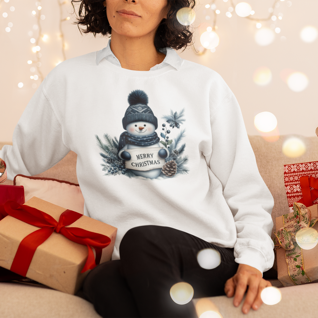 Person wearing a white sweatshirt with a Christmas design, surrounded by festive decorations and presents.
