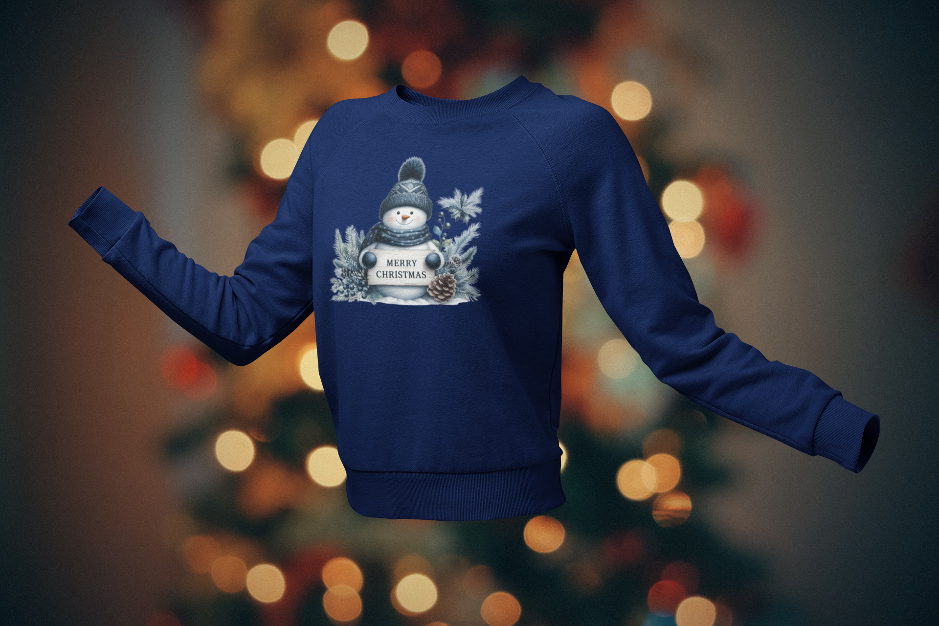 Blue sweatshirt with a snowman design on a blurred Christmas tree background