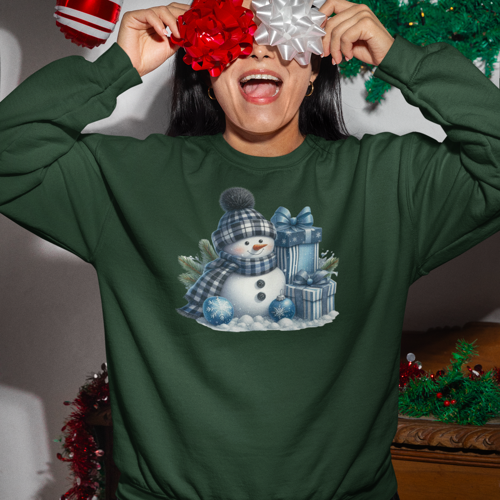 Person wearing a green sweatshirt with a snowman design, surrounded by Christmas decorations.