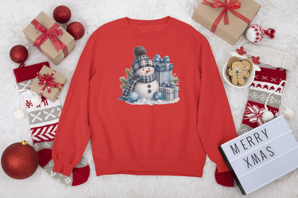Red sweatshirt with a snowman design surrounded by Christmas decorations on a white background