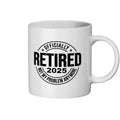 White mug with black text 'OFFICIALLY RETIRED 2025 NOT MY PROBLEM ANYMORE' on a white background