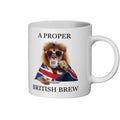 White mug with a lion wearing sunglasses and a Union Jack flag, holding a cup, with text 'A Proper British Brew' on a white background.