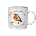 White mug with a robin illustration and text on a white background