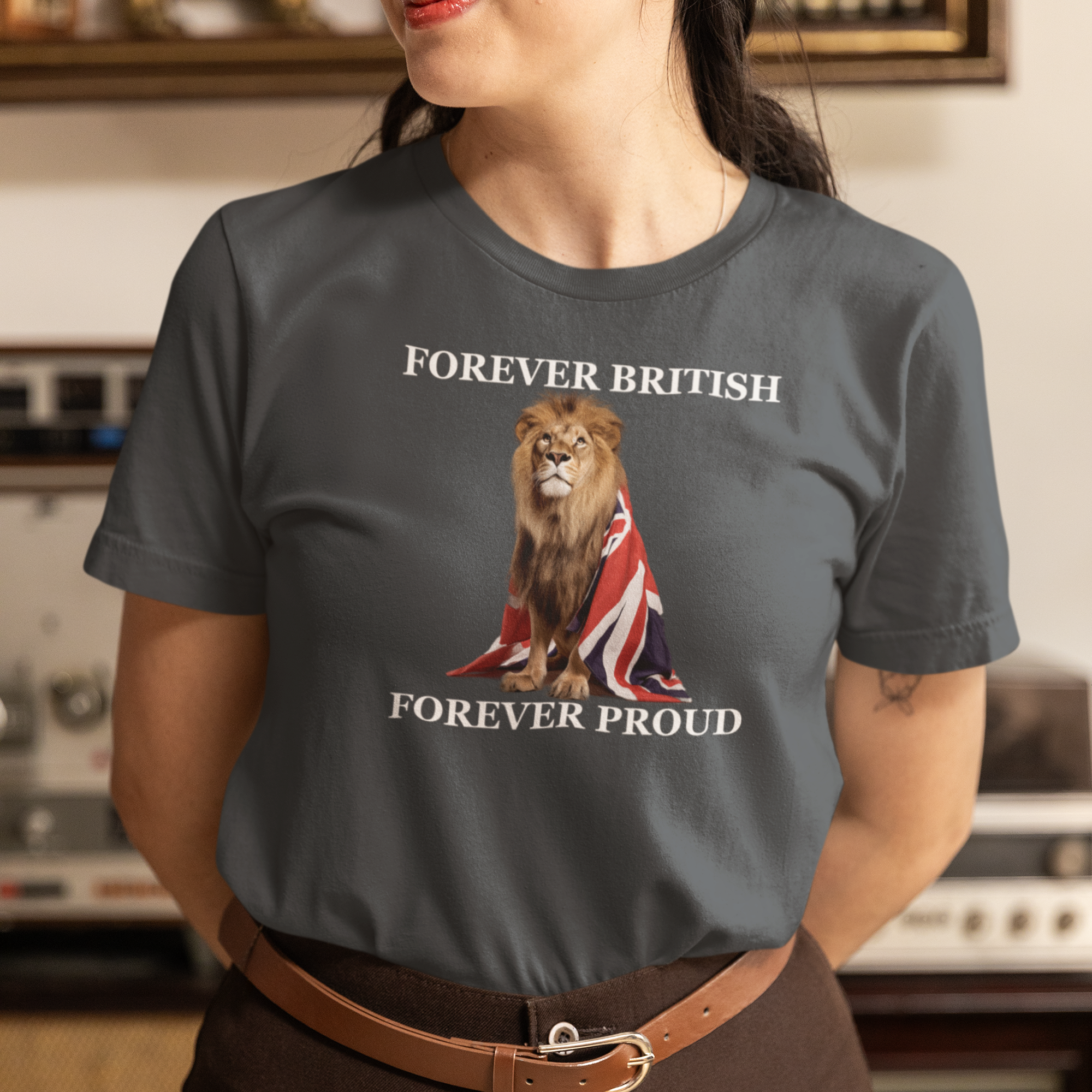 Person wearing a t-shirt with a lion and Union Jack design, text 'Forever British Forever Proud' in a room.