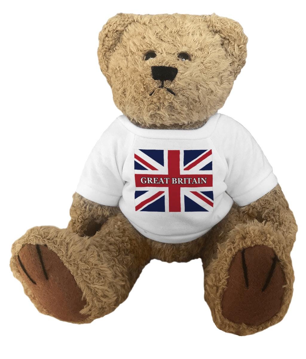Teddy bear wearing a white shirt with a Great Britain flag design on a white background