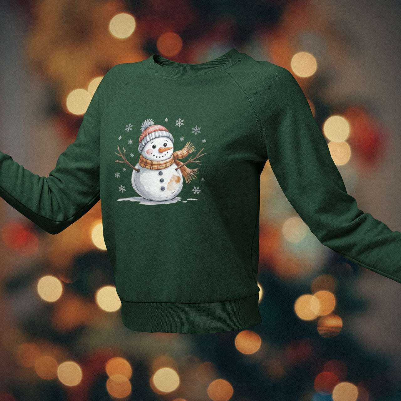 Green sweatshirt with a snowman design on a blurred bokeh background