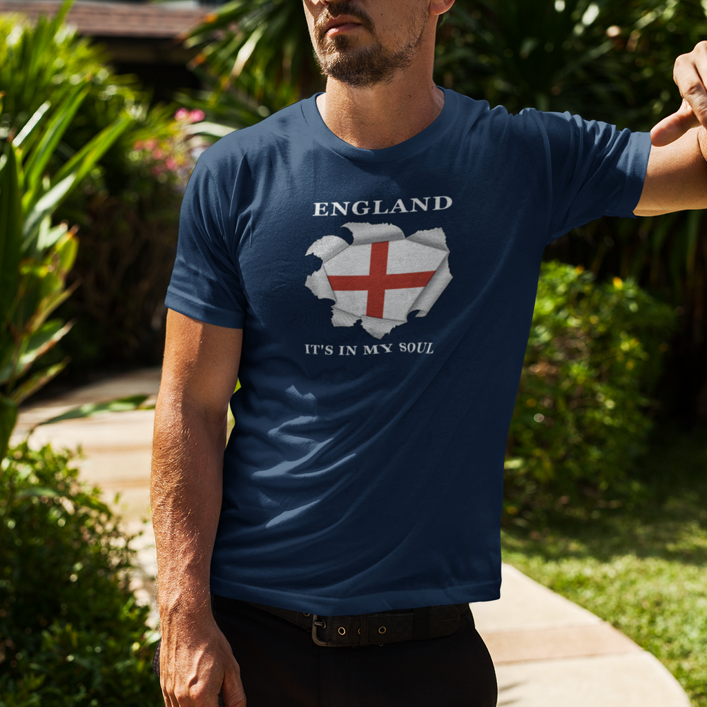 Man wearing a blue t-shirt with a graphic design outdoors