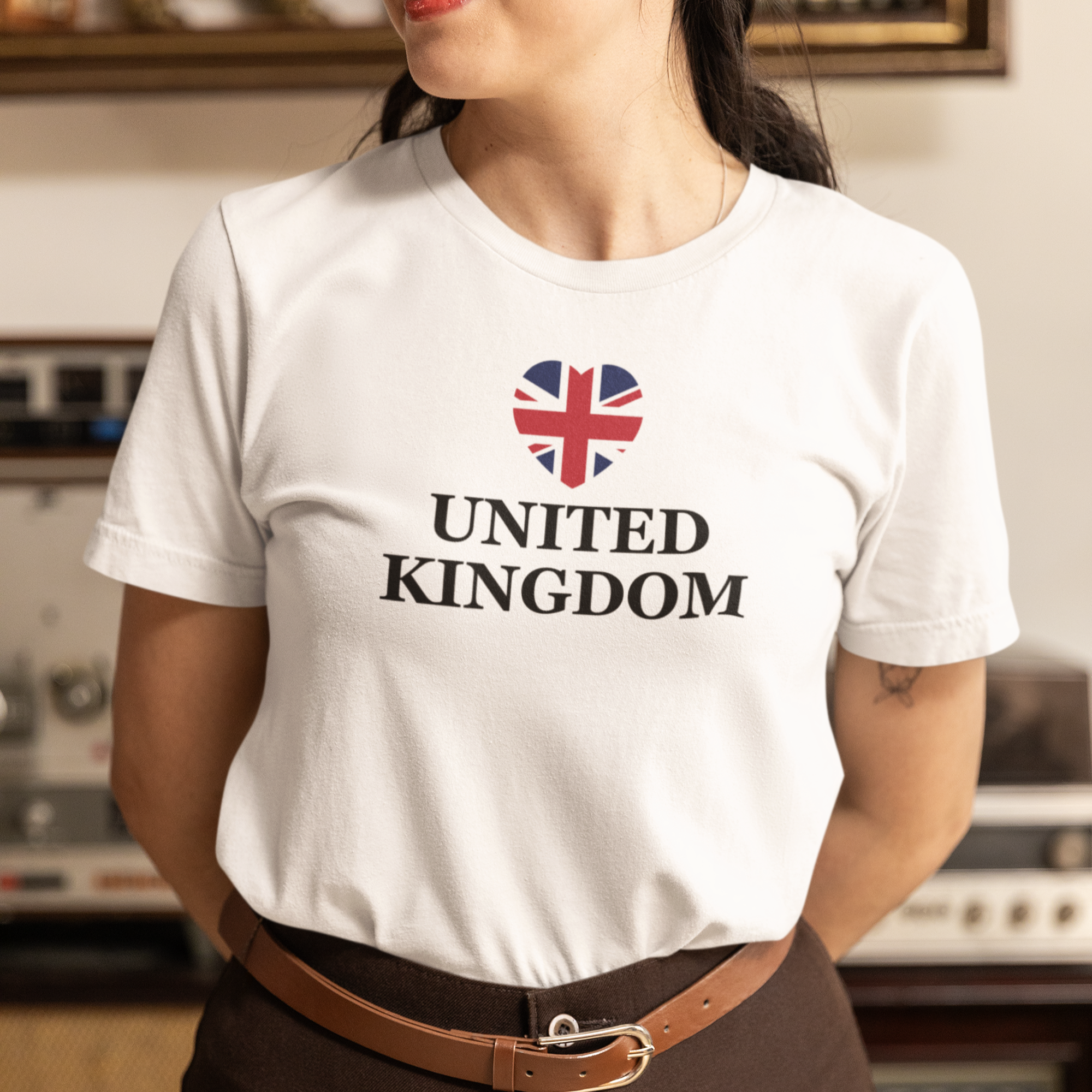 Person wearing a white t-shirt with 'United Kingdom' and a Union Jack design.