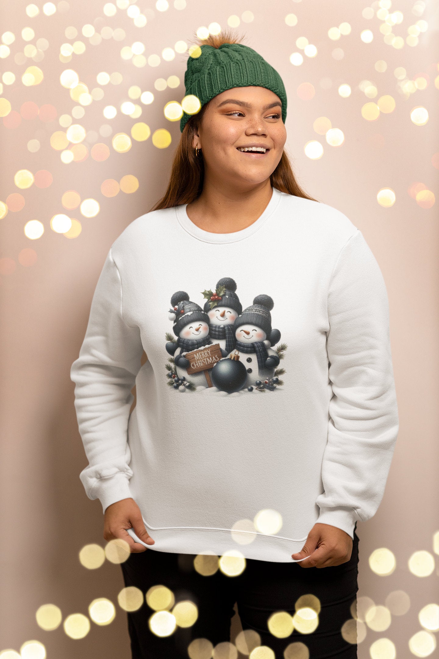 Person wearing a white sweatshirt with a snowman design against a bokeh light background