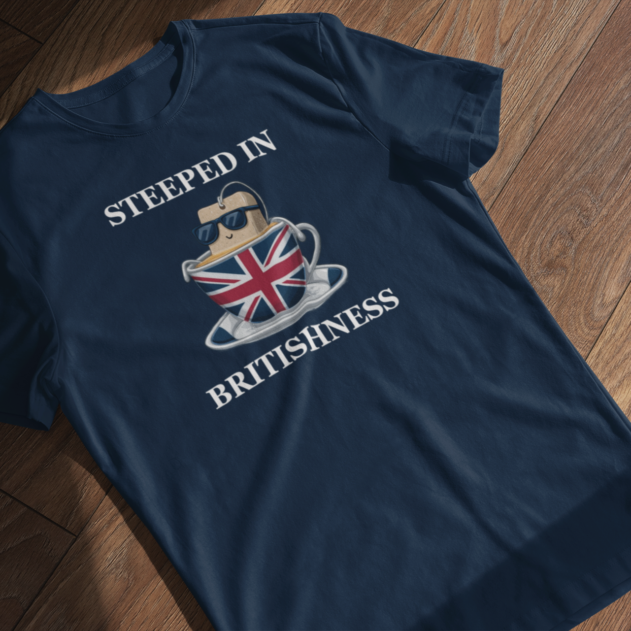 Navy blue t-shirt with a graphic design on a wooden floor