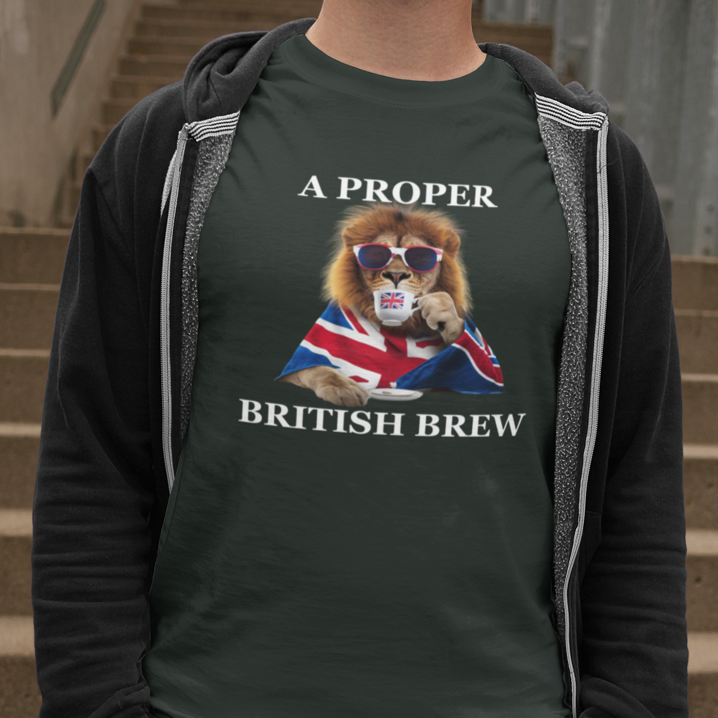 Person wearing a green t-shirt with a lion graphic and text on a set of stairs.
