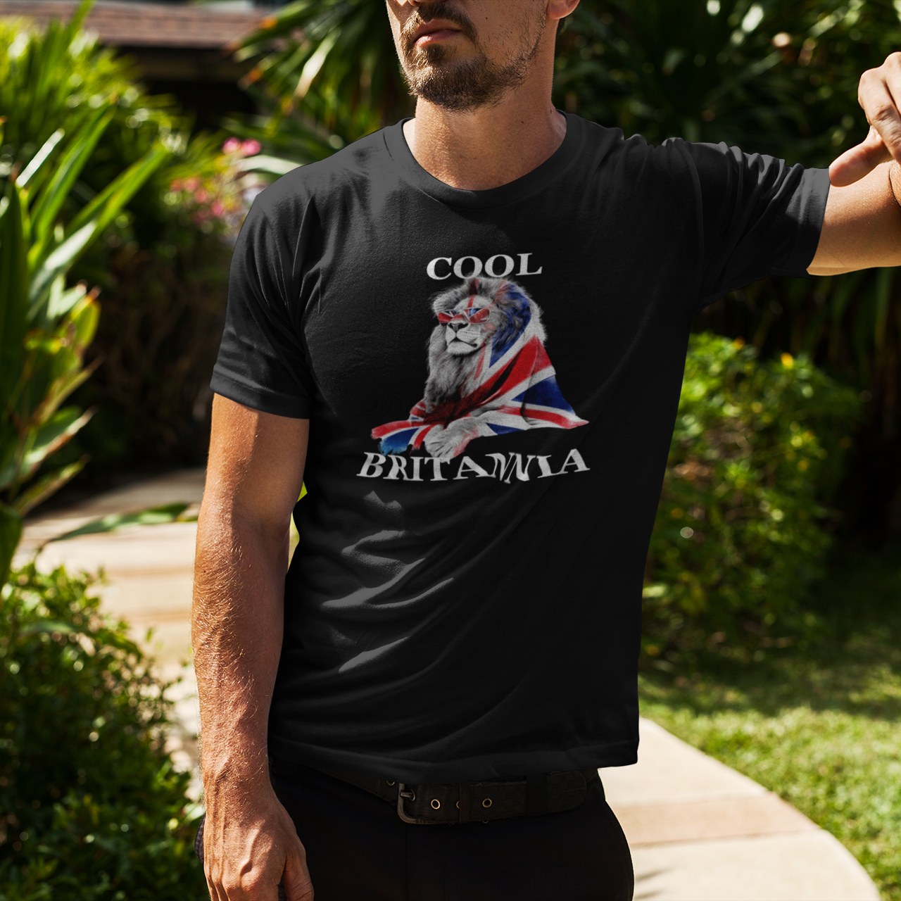 Man wearing a black t-shirt with a graphic design outdoors