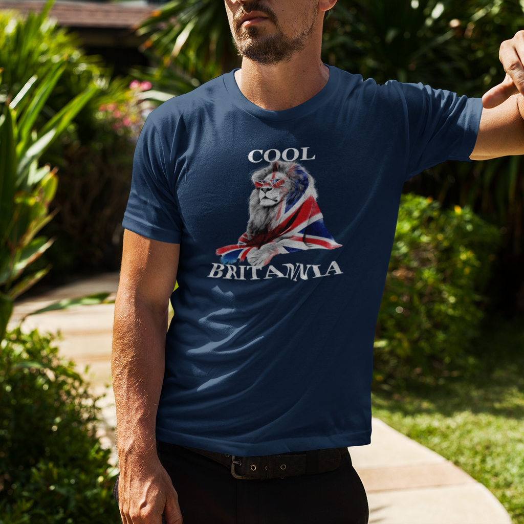 Man wearing a blue t-shirt with a lion and Union Jack design, standing outdoors.