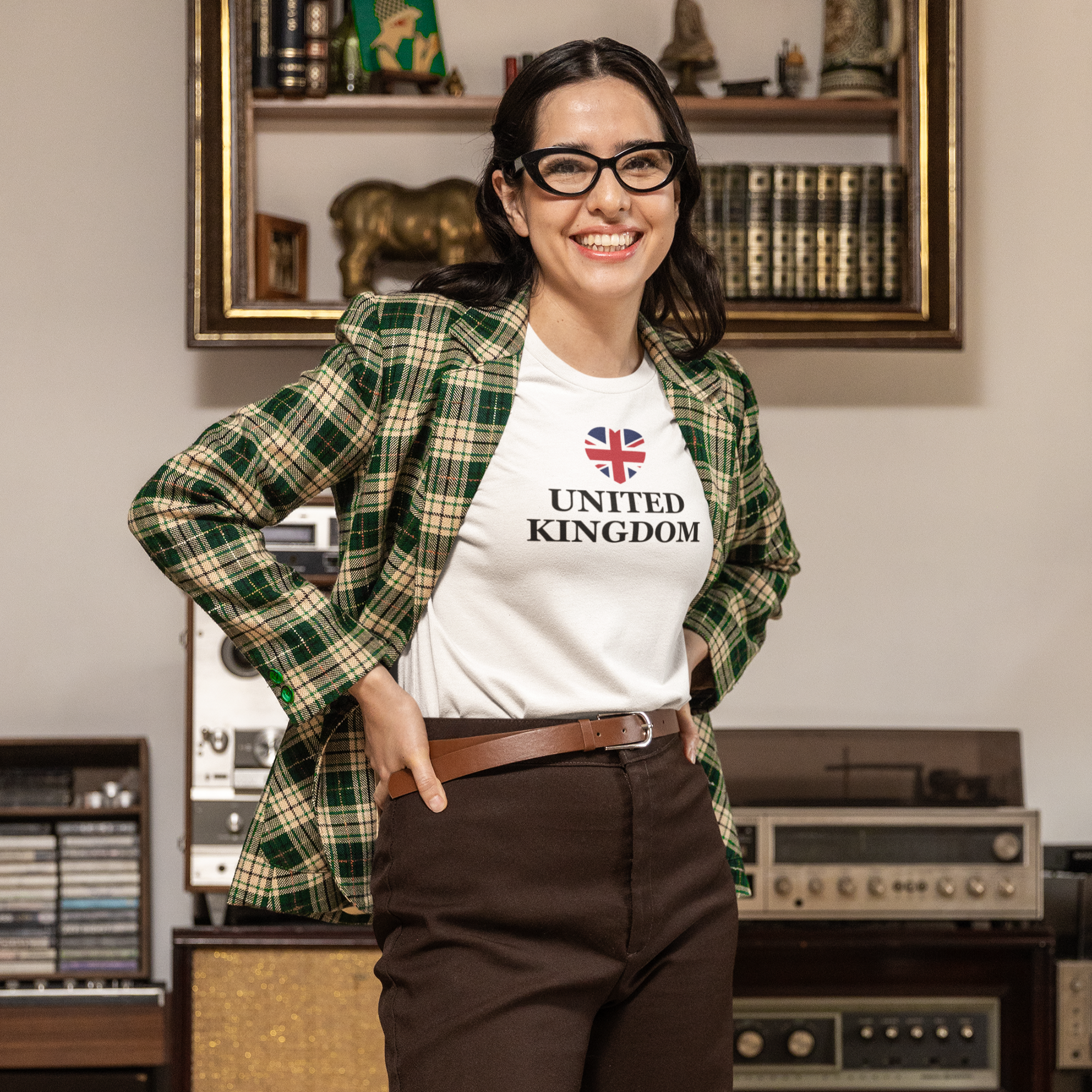 Woman wearing a 'United Kingdom' t-shirt in a room with vintage equipment