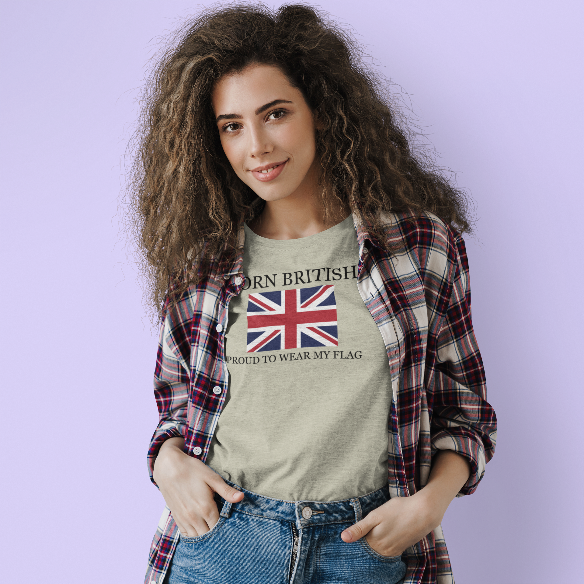 Woman wearing a t-shirt with a Union Jack design and text on a light purple background