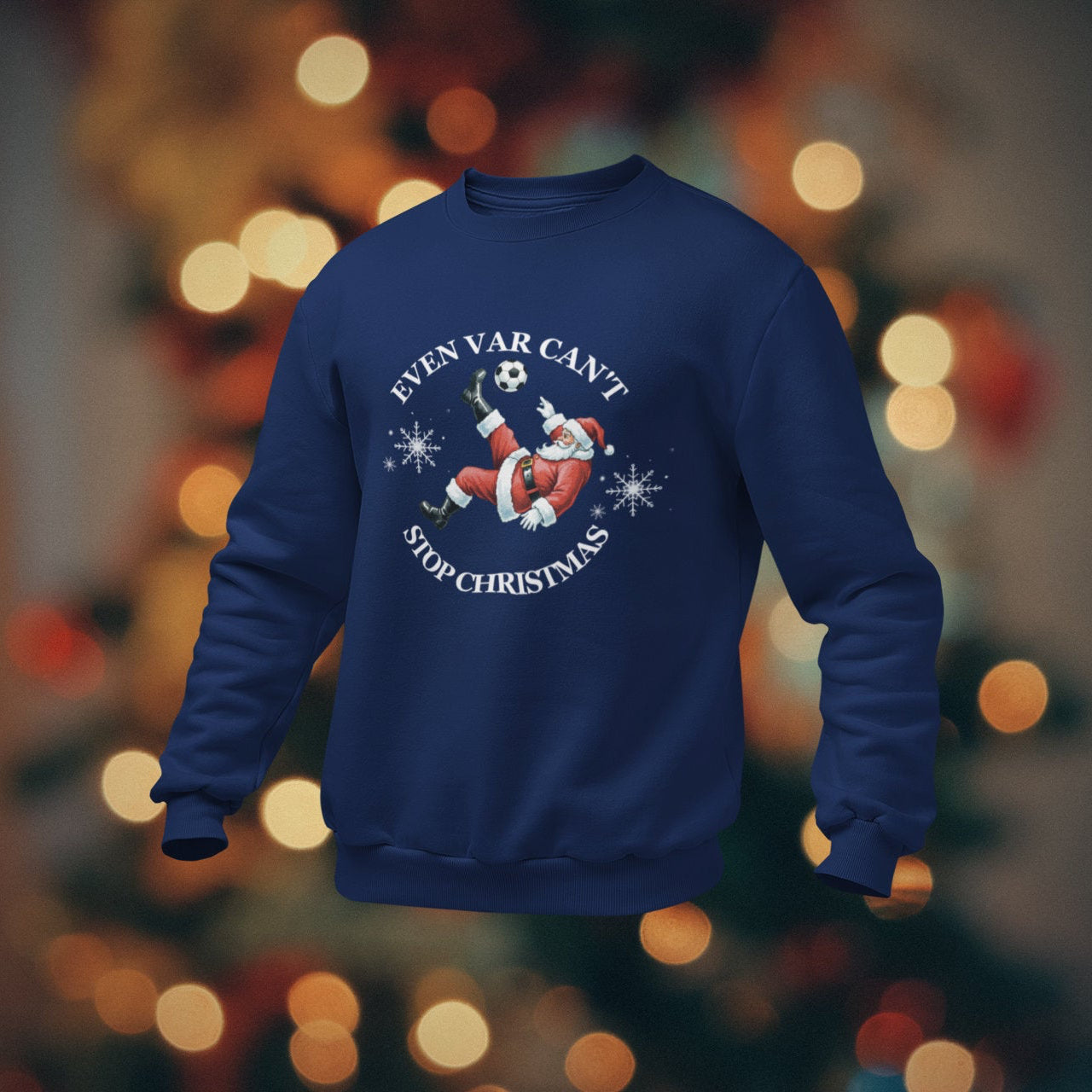 Blue sweatshirt with Christmas design on a blurred bokeh background