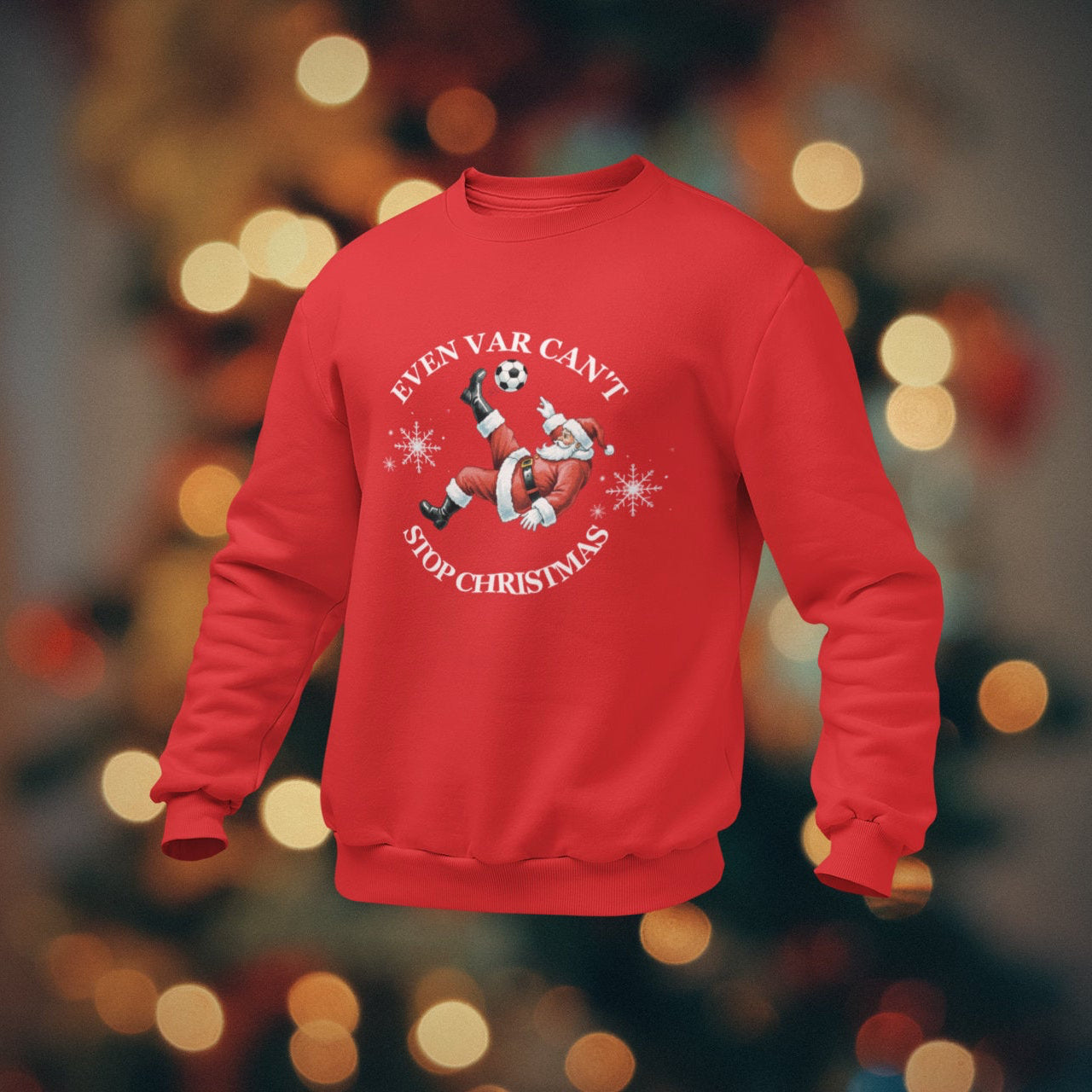 Red sweatshirt with Christmas design on a blurred background