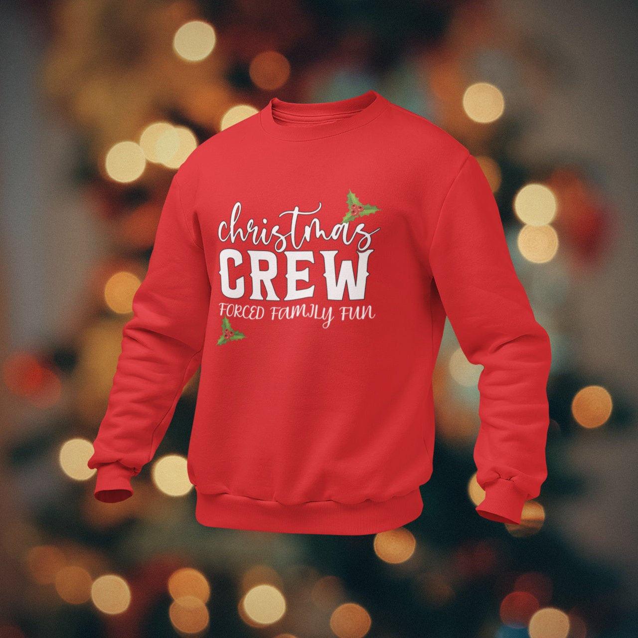 Red sweatshirt with 'Christmas Crew' text on a blurred bokeh background