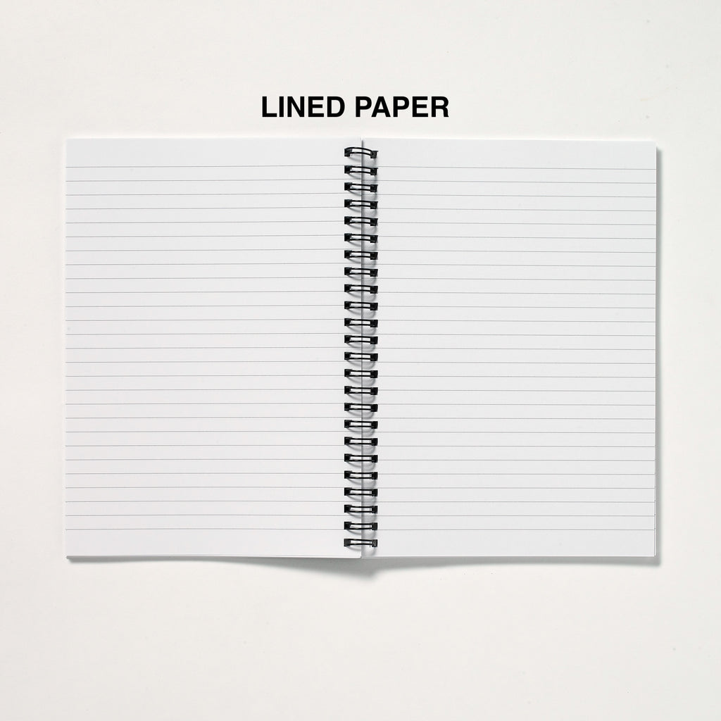 Open notebook with lined paper on a white background