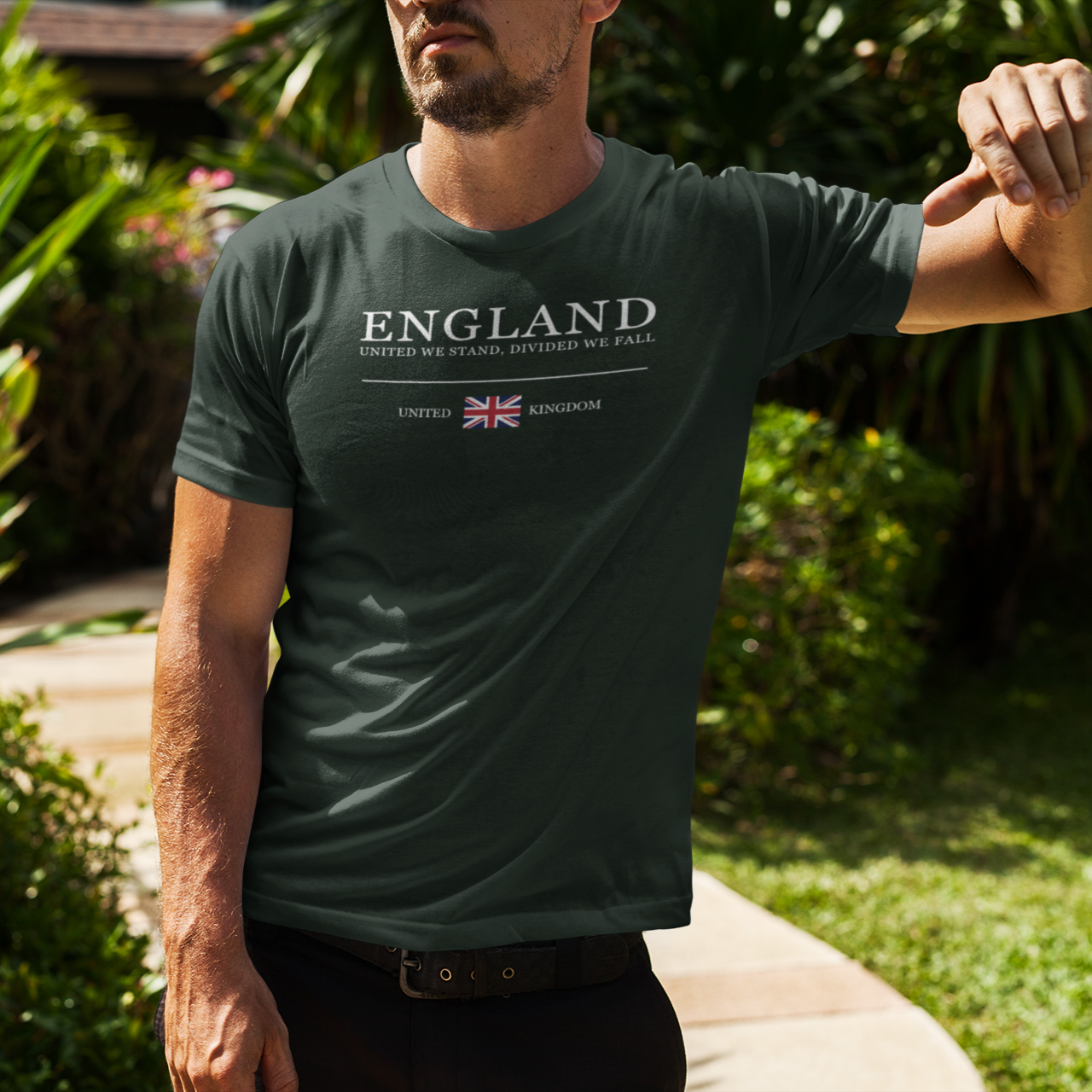 Man wearing a green t-shirt with 'ENGLAND' text and Union Jack, standing outdoors.