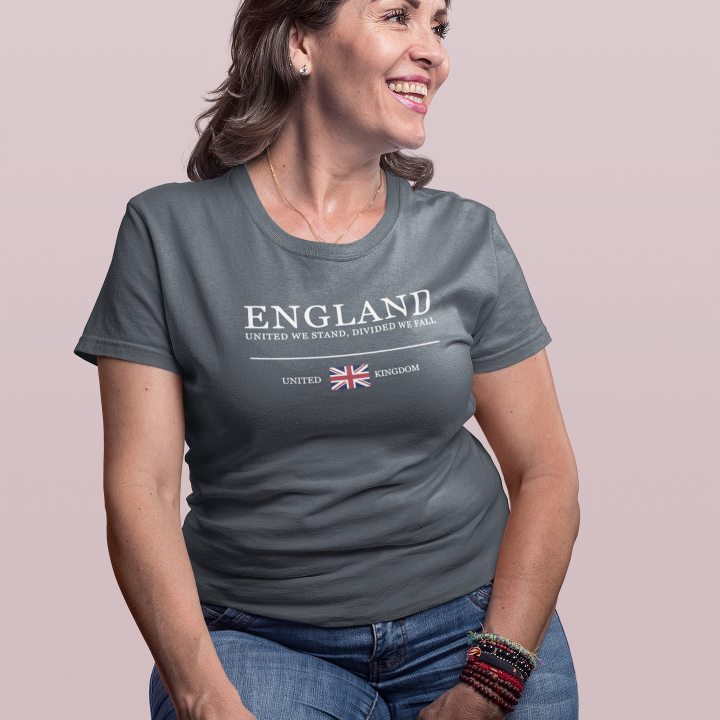Woman wearing a gray t-shirt with 'England' text and British flag design on a light pink background