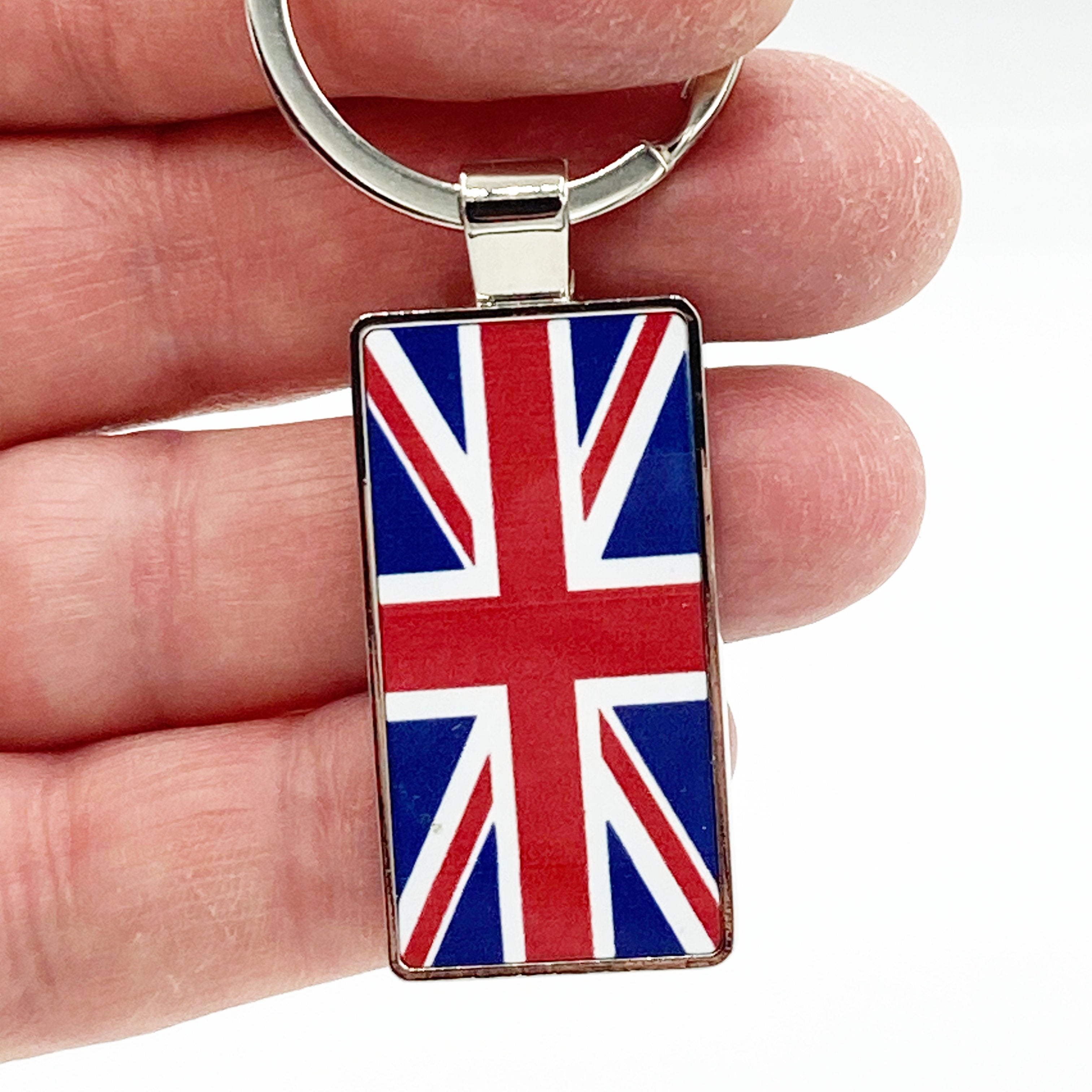 Keychain with Union Jack design held between fingers