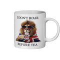 White mug with a lion wearing sunglasses and a Union Jack flag, text 'I Don't Roar Before Tea' on a white background.