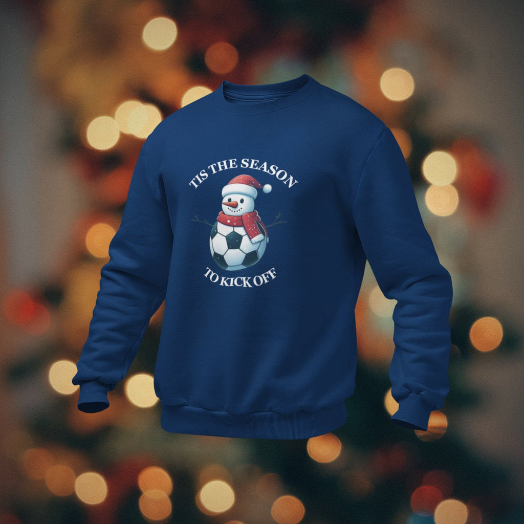 Blue sweatshirt with Christmas-themed design on a blurred lights background